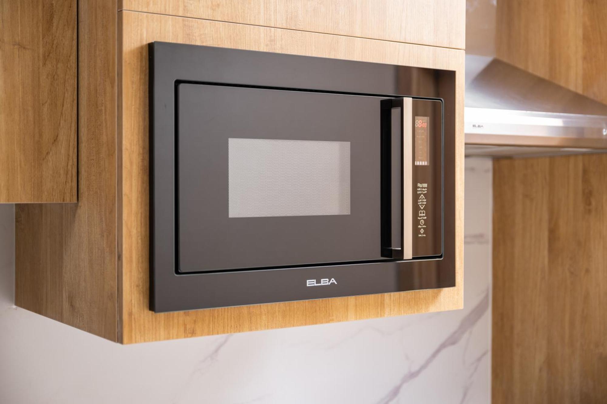 Taiba Suites Madinah Medina Exterior photo Microwaves are a common household appliance.